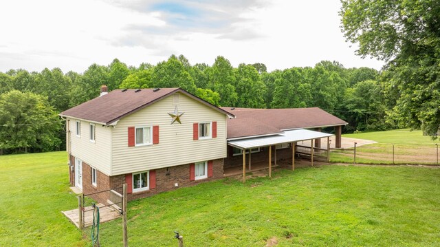 3037 Tunnel Rd, Westmoreland, TN 37186 - back of house featuring a chimney and brick siding