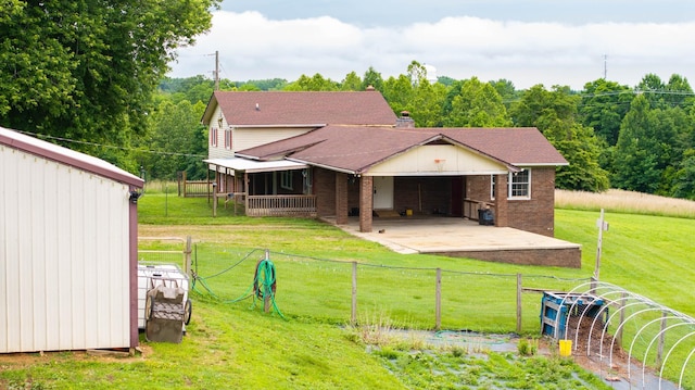 3037 Tunnel Rd, Westmoreland, TN 37186 - back of house featuring brick siding and a patio area