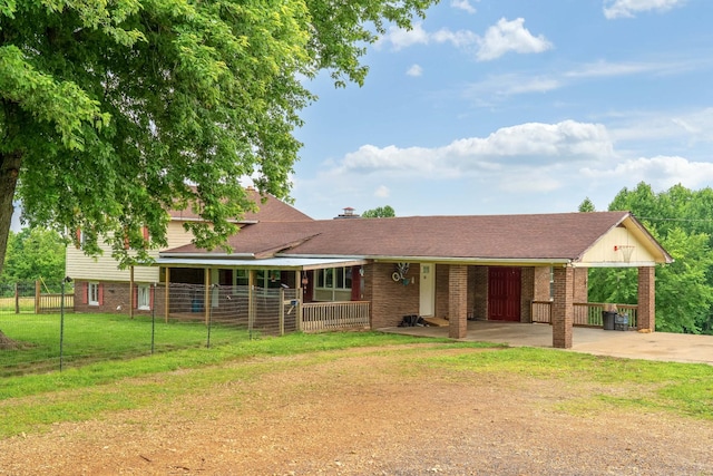 3037 Tunnel Rd, Westmoreland, TN 37186 - view of front of property with concrete driveway, an attached carport, and a porch
