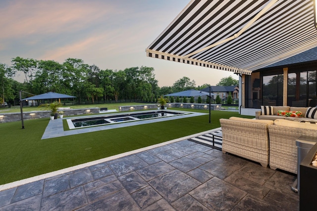 1485 Harrison Rd, Murfreesboro, TN 37128 - patio terrace at dusk with a patio area, outdoor lounge area, a yard, and a pool with connected hot tub