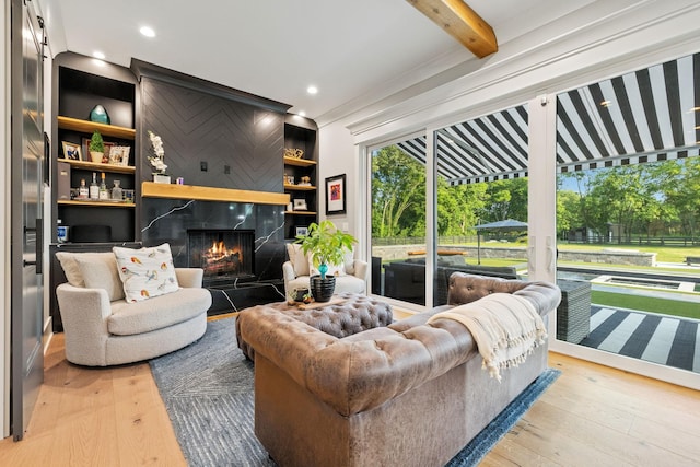 1485 Harrison Rd, Murfreesboro, TN 37128 - living area featuring wood-type flooring, a high end fireplace, built in features, and recessed lighting
