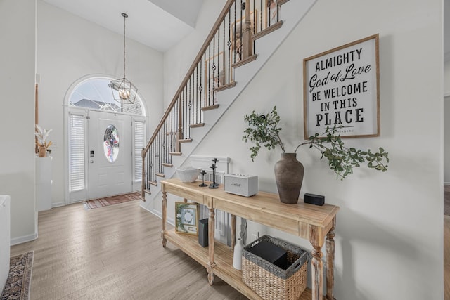 134 Chisum Ct, Clarksville, TN 37043 - foyer entrance featuring stairs, a high ceiling, a chandelier, and wood finished floors