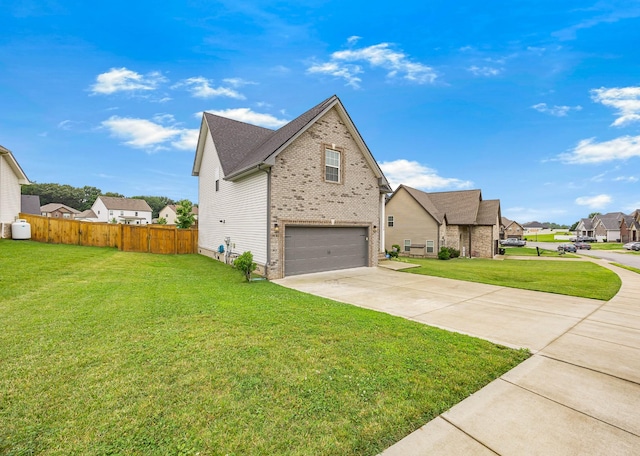 134 Chisum Ct, Clarksville, TN 37043 - view of side of property featuring an attached garage, driveway, brick siding, and a residential view