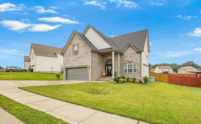134 Chisum Ct, Clarksville, TN 37043 - traditional home featuring an attached garage, concrete driveway, brick siding, and roof with shingles