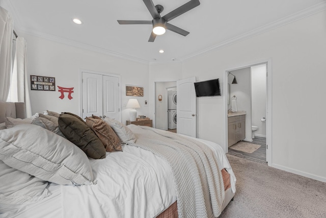 134 Chisum Ct, Clarksville, TN 37043 - carpeted bedroom featuring stacked washer and clothes dryer, ornamental molding, recessed lighting, a closet, and ensuite bath