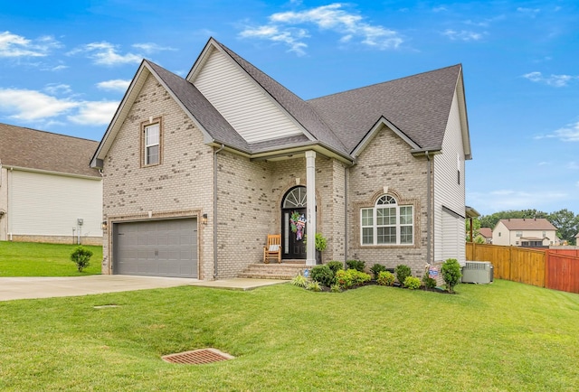 134 Chisum Ct, Clarksville, TN 37043 - view of front facade featuring a garage, concrete driveway, brick siding, and roof with shingles