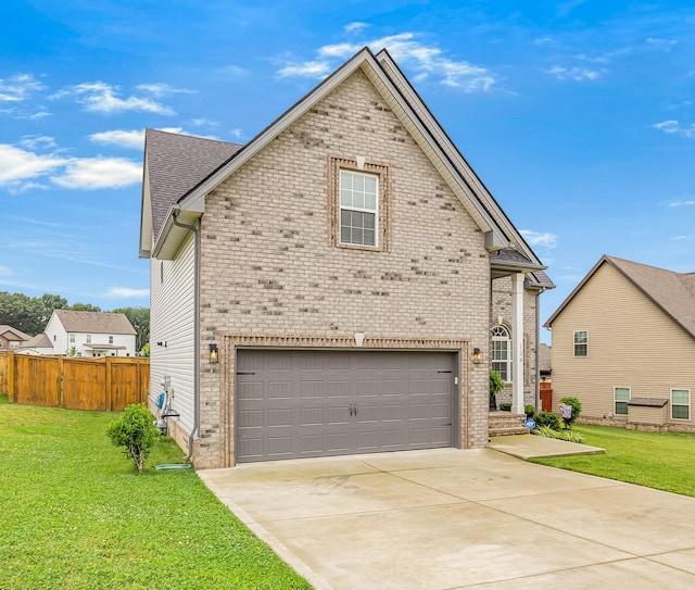 134 Chisum Ct, Clarksville, TN 37043 - traditional home featuring an attached garage, brick siding, and driveway