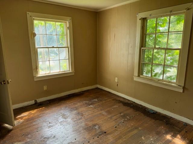 421 Hickman St, Columbia, TN 38401 - unfurnished room featuring hardwood / wood-style floors, crown molding, and wooden walls