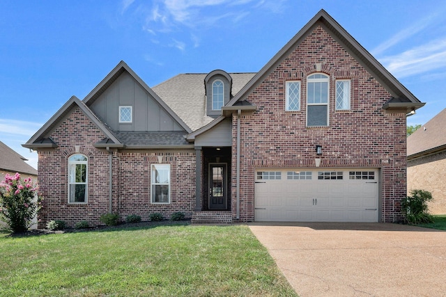 215 Ernest Dr, Lebanon, TN 37087 - view of front facade with brick siding, concrete driveway, a front lawn, roof with shingles, and an attached garage