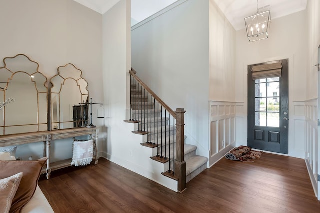 215 Ernest Dr, Lebanon, TN 37087 - foyer entrance featuring wood finished floors, stairway, a high ceiling, a chandelier, and a decorative wall