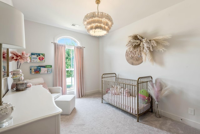 215 Ernest Dr, Lebanon, TN 37087 - bedroom with light carpet, a chandelier, and a crib