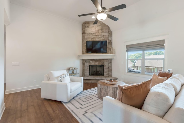 215 Ernest Dr, Lebanon, TN 37087 - living area with wood finished floors, ceiling fan, a stone fireplace, vaulted ceiling, and ornamental molding
