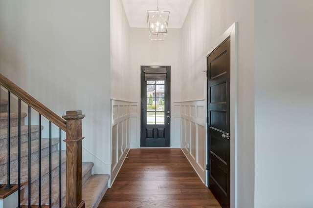 215 Ernest Dr, Lebanon, TN 37087 - entryway featuring a decorative wall, a chandelier, stairway, dark wood-style floors, and a wainscoted wall