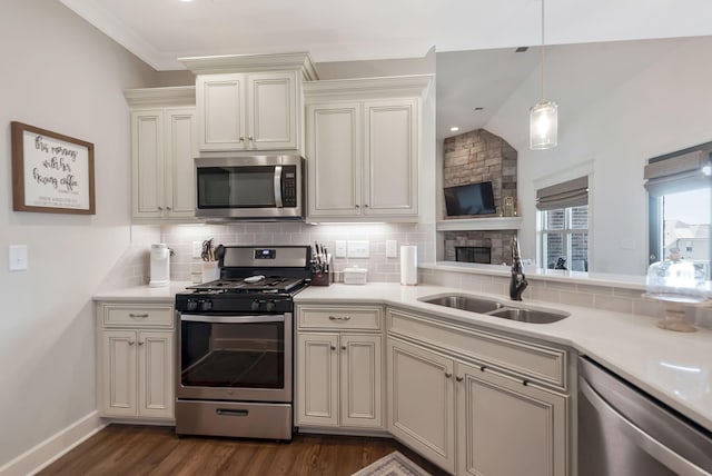 215 Ernest Dr, Lebanon, TN 37087 - kitchen featuring stainless steel appliances, backsplash, light countertops, dark wood-style flooring, and lofted ceiling
