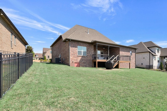 215 Ernest Dr, Lebanon, TN 37087 - rear view of house featuring brick siding, a fenced backyard, ceiling fan, and stairs