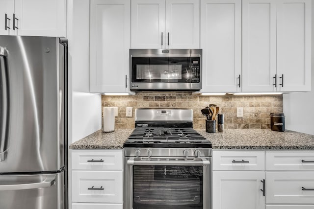 1055 Wittys Way, Clarksville, TN 37043 - kitchen featuring stainless steel appliances, decorative backsplash, and white cabinets