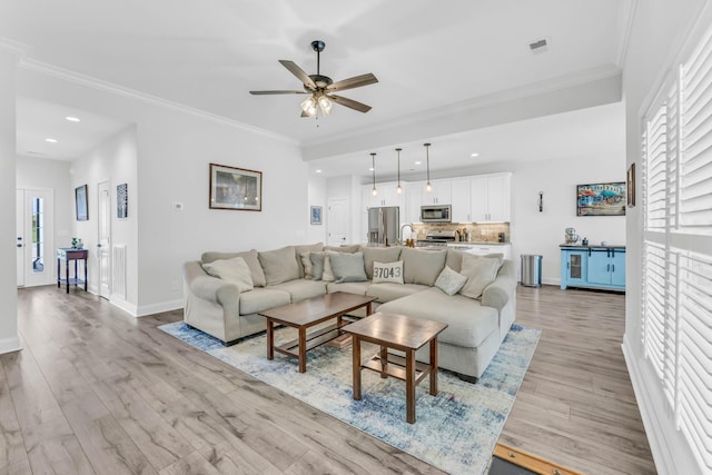 1055 Wittys Way, Clarksville, TN 37043 - living room with light wood-style flooring, ceiling fan, healthy amount of natural light, recessed lighting, and crown molding