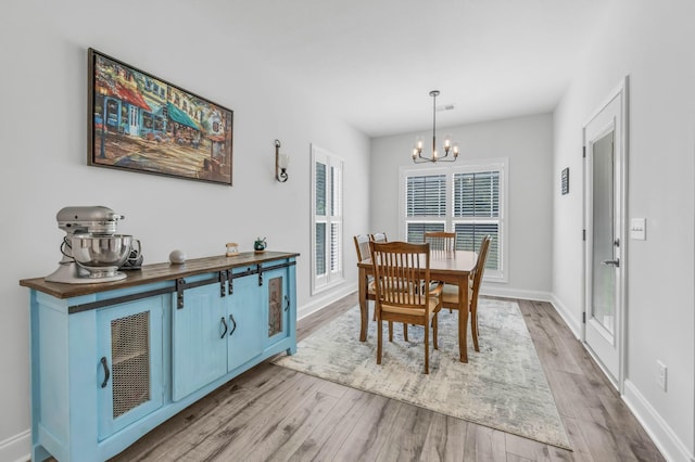 1055 Wittys Way, Clarksville, TN 37043 - dining room with a chandelier and light wood-type flooring