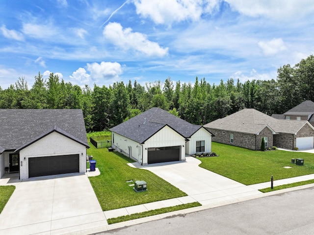 1055 Wittys Way, Clarksville, TN 37043 - view of front of property featuring board and batten siding, a front yard, concrete driveway, and an attached garage