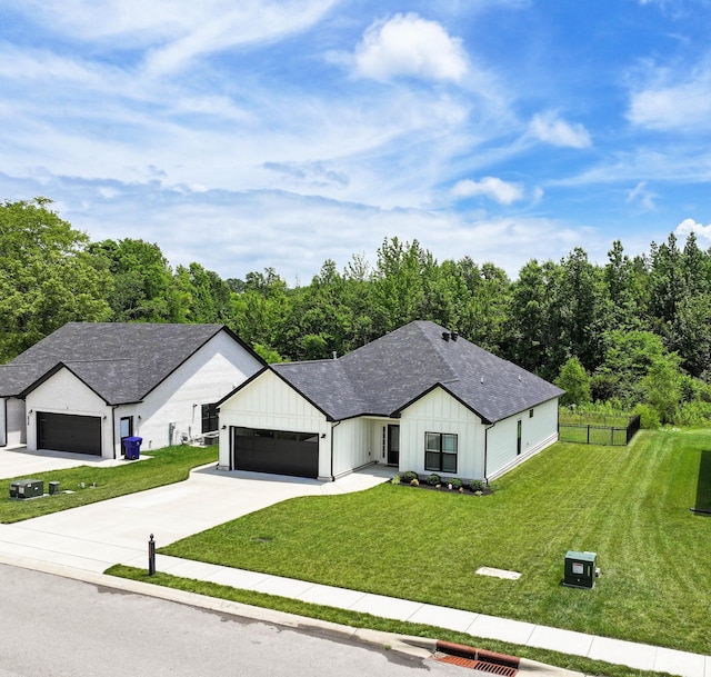 1055 Wittys Way, Clarksville, TN 37043 - modern farmhouse style home featuring a garage, board and batten siding, driveway, and a shingled roof