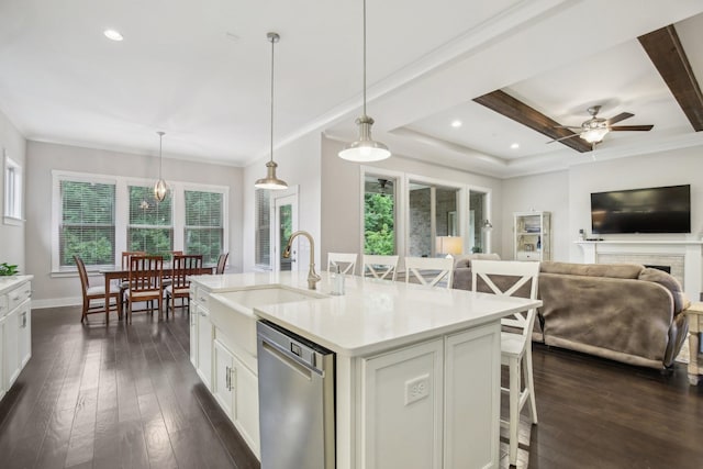 2016 Oliver Dr, Mount Juliet, TN 37122 - kitchen featuring dishwasher, a breakfast bar, light countertops, white cabinets, and a ceiling fan