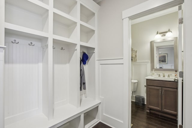 2016 Oliver Dr, Mount Juliet, TN 37122 - mudroom with dark wood finished floors, a wainscoted wall, and a decorative wall