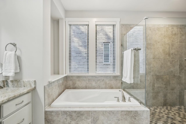 2016 Oliver Dr, Mount Juliet, TN 37122 - bathroom featuring a garden tub, tiled shower, and vanity