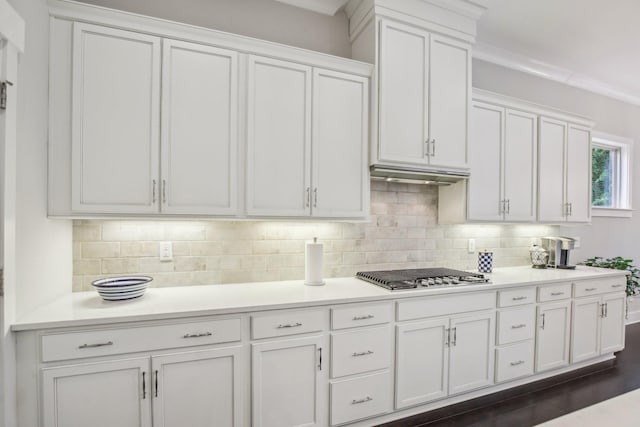 2016 Oliver Dr, Mount Juliet, TN 37122 - kitchen featuring stainless steel gas cooktop, white cabinetry, decorative backsplash, light countertops, and under cabinet range hood