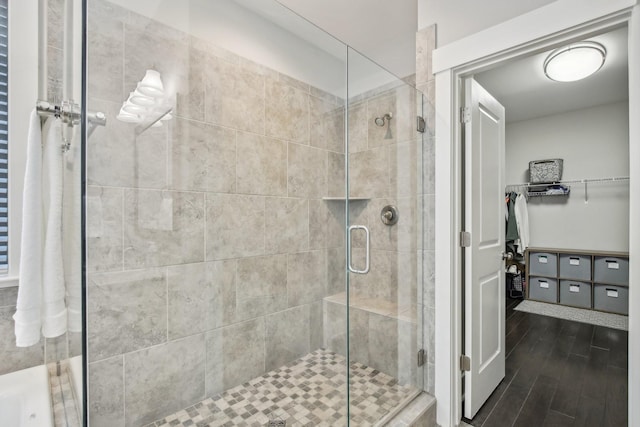 2016 Oliver Dr, Mount Juliet, TN 37122 - full bathroom with a shower stall, a walk in closet, and wood finished floors