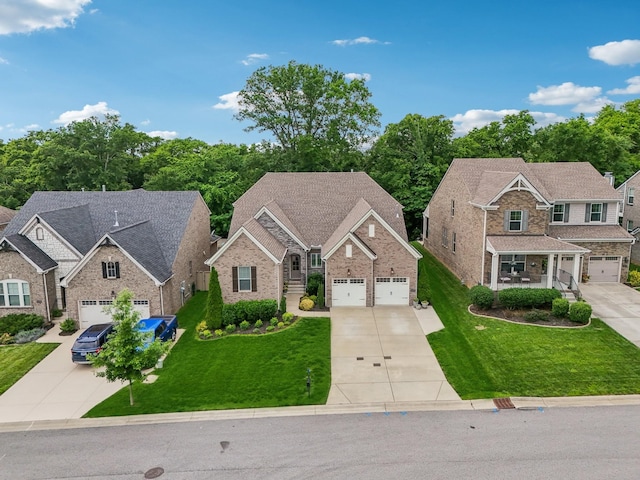 2016 Oliver Dr, Mount Juliet, TN 37122 - view of front facade with driveway, a garage, and a front lawn