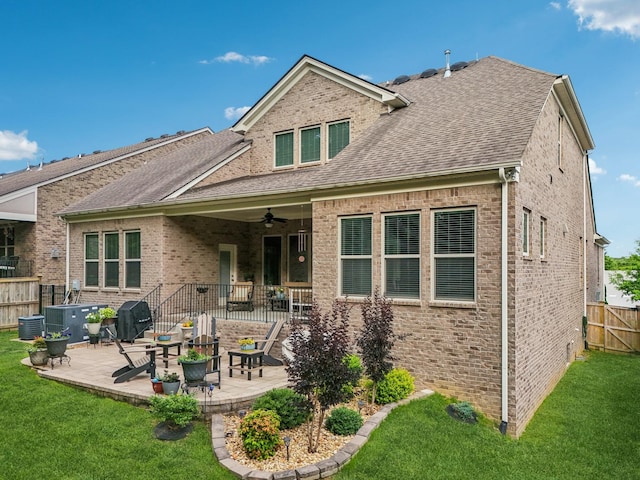 2016 Oliver Dr, Mount Juliet, TN 37122 - rear view of property featuring a patio area, a ceiling fan, brick siding, and a shingled roof
