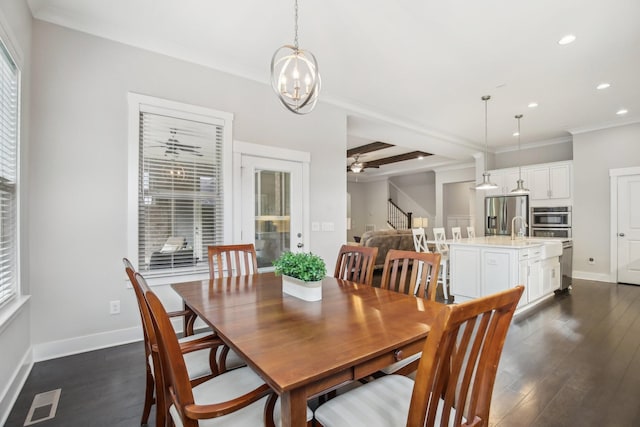2016 Oliver Dr, Mount Juliet, TN 37122 - dining area with ornamental molding, recessed lighting, dark wood-style flooring, stairs, and a chandelier