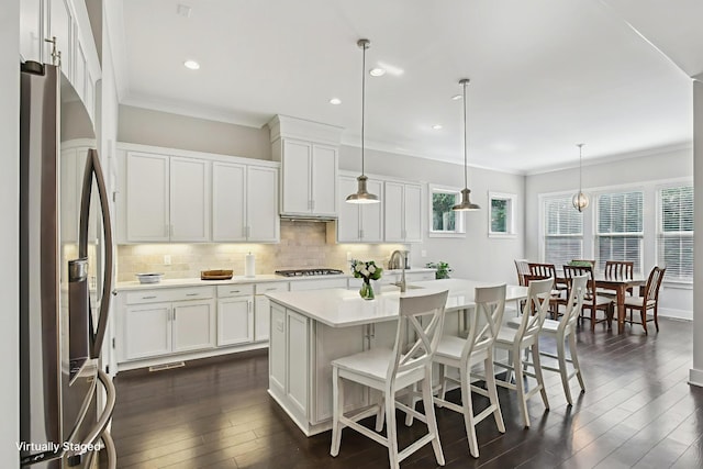 2016 Oliver Dr, Mount Juliet, TN 37122 - kitchen with stainless steel fridge, decorative backsplash, dark wood-style floors, light countertops, and crown molding
