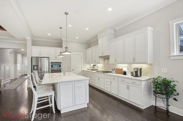 2016 Oliver Dr, Mount Juliet, TN 37122 - kitchen with stainless steel appliances, white cabinetry, light countertops, backsplash, and recessed lighting