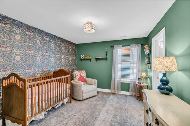 652 Taylor Bend Rd, Columbia, TN 38401 - bedroom featuring an accent wall, wallpapered walls, carpet, and a crib