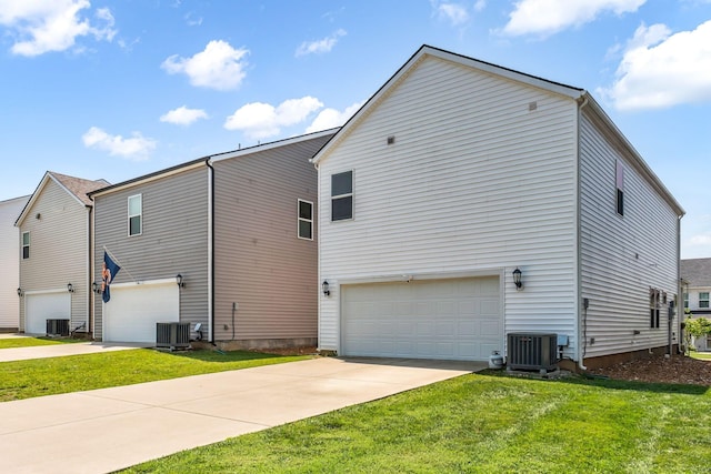 652 Taylor Bend Rd, Columbia, TN 38401 - back of property with an attached garage, a yard, and driveway