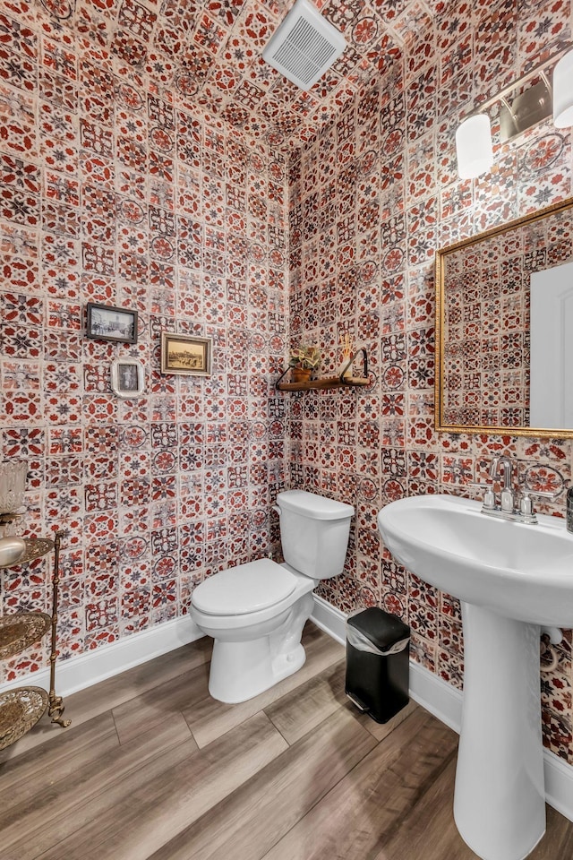 652 Taylor Bend Rd, Columbia, TN 38401 - bathroom featuring wallpapered walls and wood finished floors