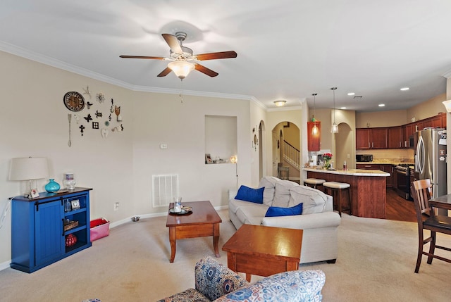 341 Lola Ln, Cottontown, TN 37048 - carpeted living area featuring arched walkways, ceiling fan, and crown molding