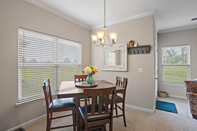 341 Lola Ln, Cottontown, TN 37048 - carpeted dining space featuring ornamental molding and a chandelier