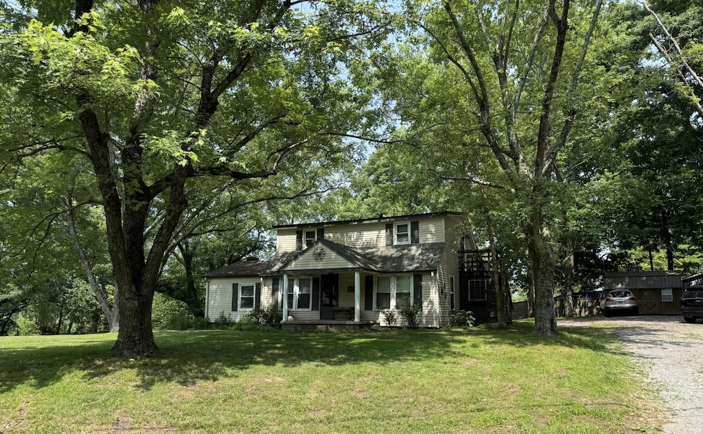 972 Weeping Willow Rd, Hendersonville, TN 37075 - traditional-style house featuring a porch, gravel driveway, and a front lawn
