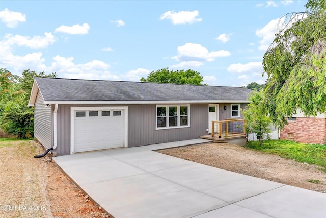 106 Nancy Dr, Clinton, TN 37716 - ranch-style home with driveway, roof with shingles, and a garage