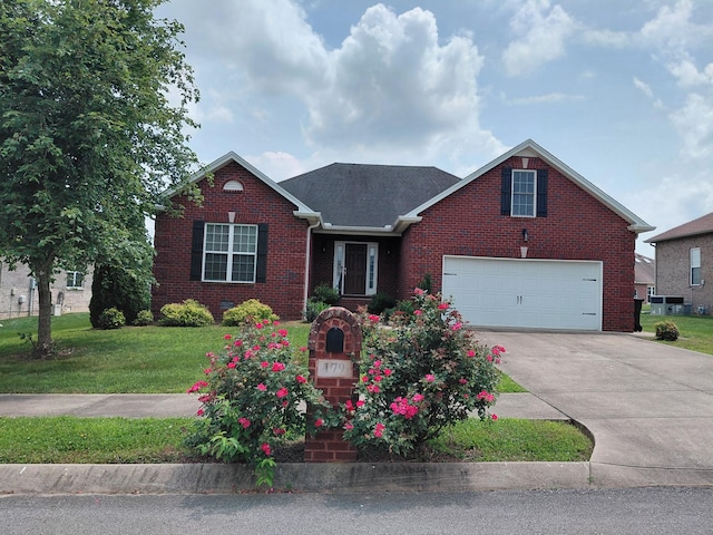179 Avalon Dr, Gallatin, TN 37066 - view of front facade with brick siding, a front lawn, and driveway