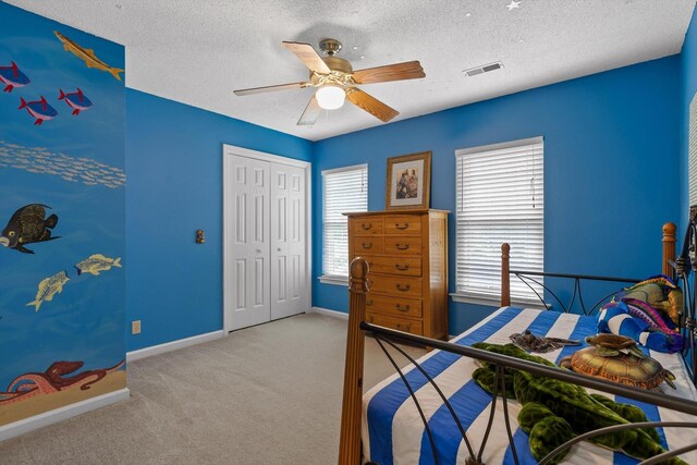 3604 Gentry Station Dr, Signal Mountain, TN 37377 - carpeted bedroom featuring a closet, a textured ceiling, and ceiling fan