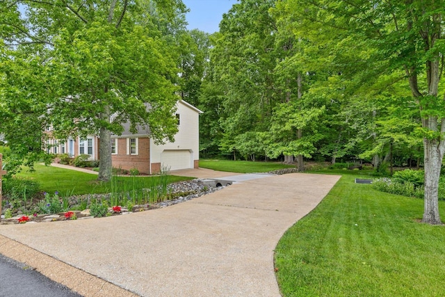 3604 Gentry Station Dr, Signal Mountain, TN 37377 - view of green lawn featuring driveway and a garage