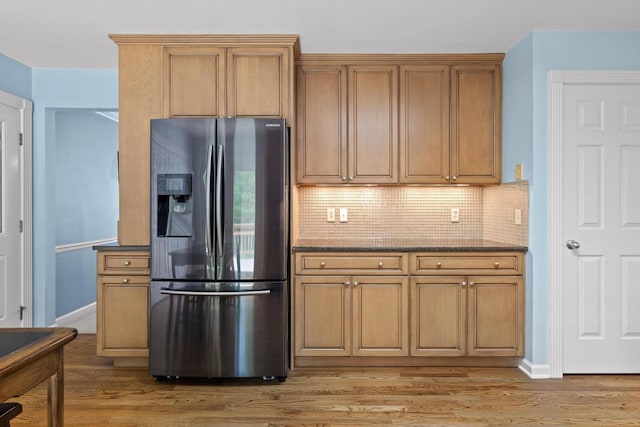 3604 Gentry Station Dr, Signal Mountain, TN 37377 - kitchen with stainless steel fridge with ice dispenser, light wood finished floors, backsplash, and dark stone counters
