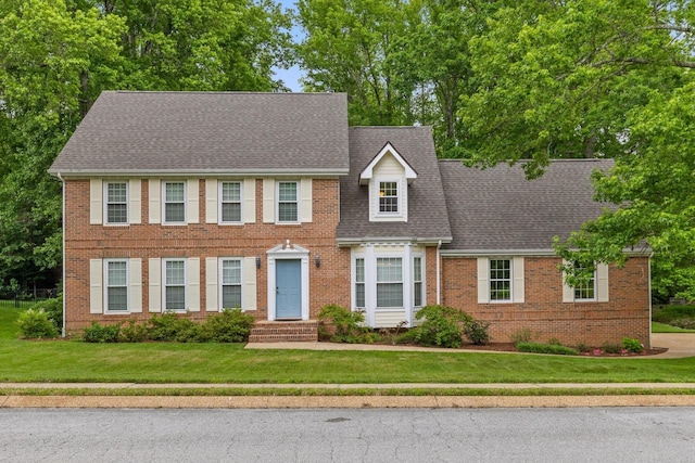3604 Gentry Station Dr, Signal Mountain, TN 37377 - colonial home featuring brick siding, a front yard, and a shingled roof