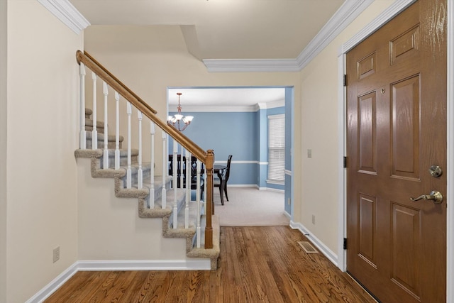 3604 Gentry Station Dr, Signal Mountain, TN 37377 - entryway featuring stairs, a chandelier, crown molding, and wood finished floors