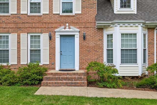 3604 Gentry Station Dr, Signal Mountain, TN 37377 - view of exterior entry with brick siding and a shingled roof