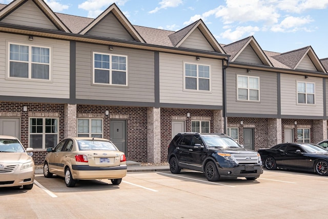 121 Bellvue Dr, Lebanon, TN 37090 - townhome / multi-family property featuring brick siding, uncovered parking, and roof with shingles