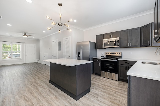 121 Bellvue Dr, Lebanon, TN 37090 - kitchen with stainless steel appliances, crown molding, light wood-style floors, electric panel, and light countertops